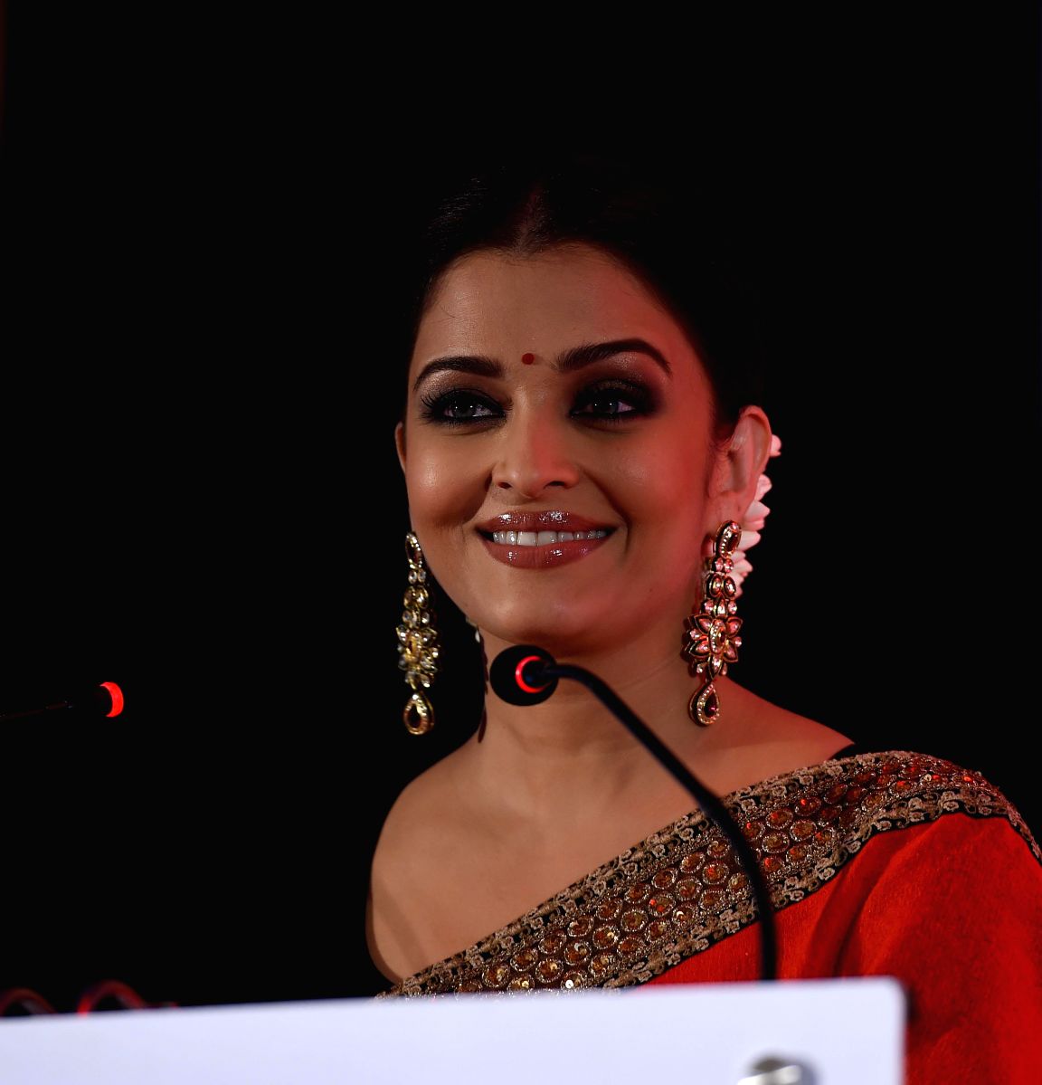 Aishwarya is the epitome of grace in this lovely red brocade saree