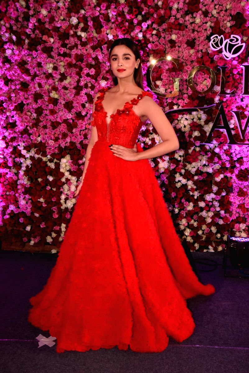 Alia looks lovely in this crimson gown with A-line flowery detail