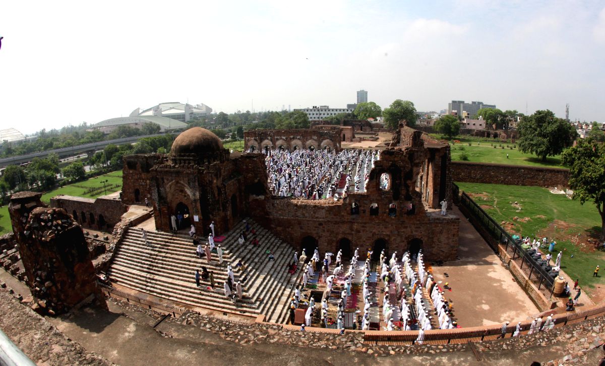 Muslims offer prayers on occassion of Eid-ul-Fitr at the Feroz Shah Kotla Fort mosque in Delhi