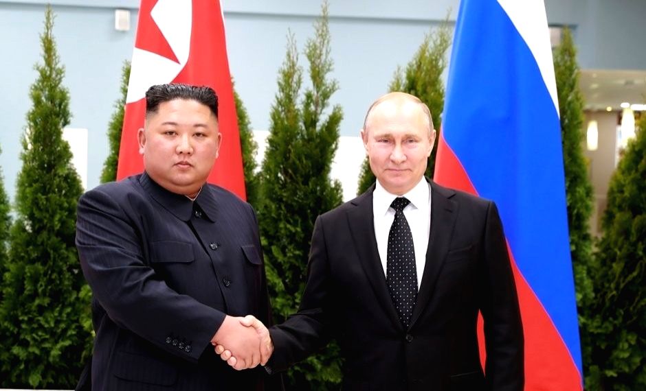 This file photo, carried by North Korea's official Korean Central News Agency, shows North Korean leader Kim Jong-un (L) and Russian President Vladimir Putin shaking hands for a summit in Vladivostok on April 26, 2019.