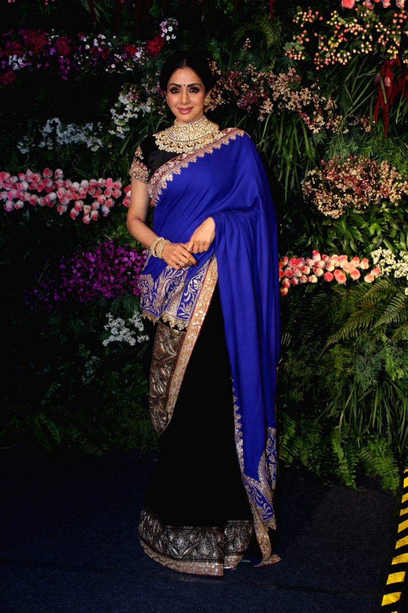 Sridevi looks regal in this midnight blue saree with intricate brocade work and elaborate embroidered neckline